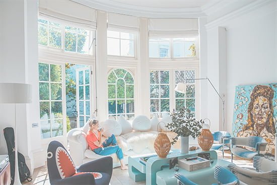 an architect ia sitting in a sunny living room