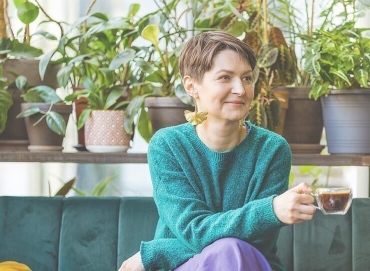 Anna Jaworska is sitting and drinking her coffee