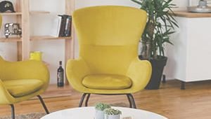 Two yellow chairs in a cosy room